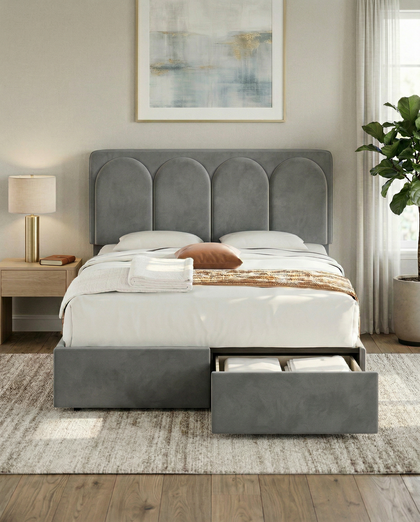 Gray upholstered bed with storage drawers in a bedroom setting.