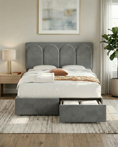 Gray upholstered bed with storage drawers in a bedroom setting.